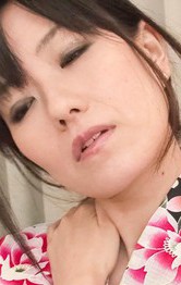 Manami Komukai Asian gets vibrator on chest and sucks two tools