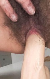Kaoru Natsuki Asian puts vibrator on clit and dildo in hairy slit